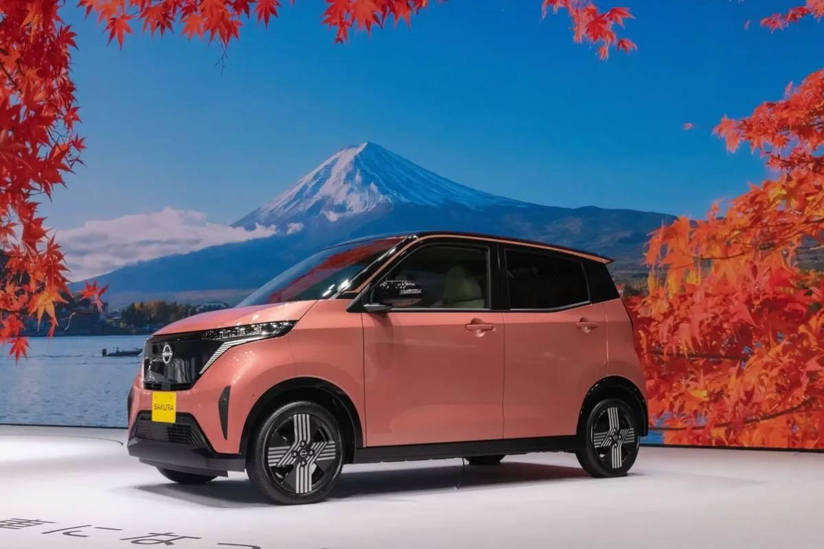 A pink Sakura electric vehicle photographed elegantly.